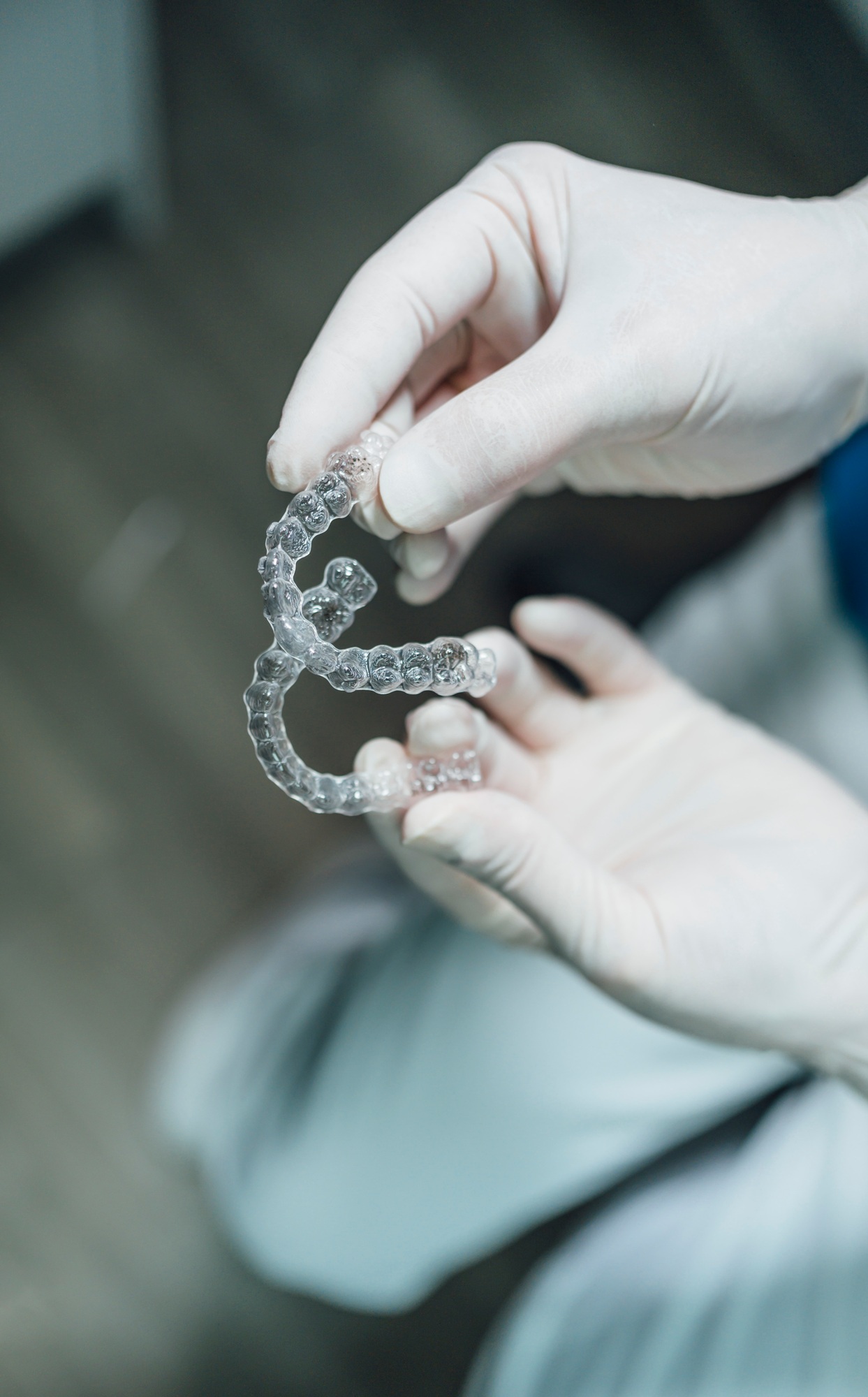Dentist hands showing new dental aligners